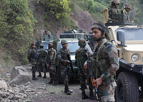 Army personnel during a search operation after a bus carrying pilgrims was ambushed by terrorists, in Reasi district of Jammu and Kashmir on Monday, June 10